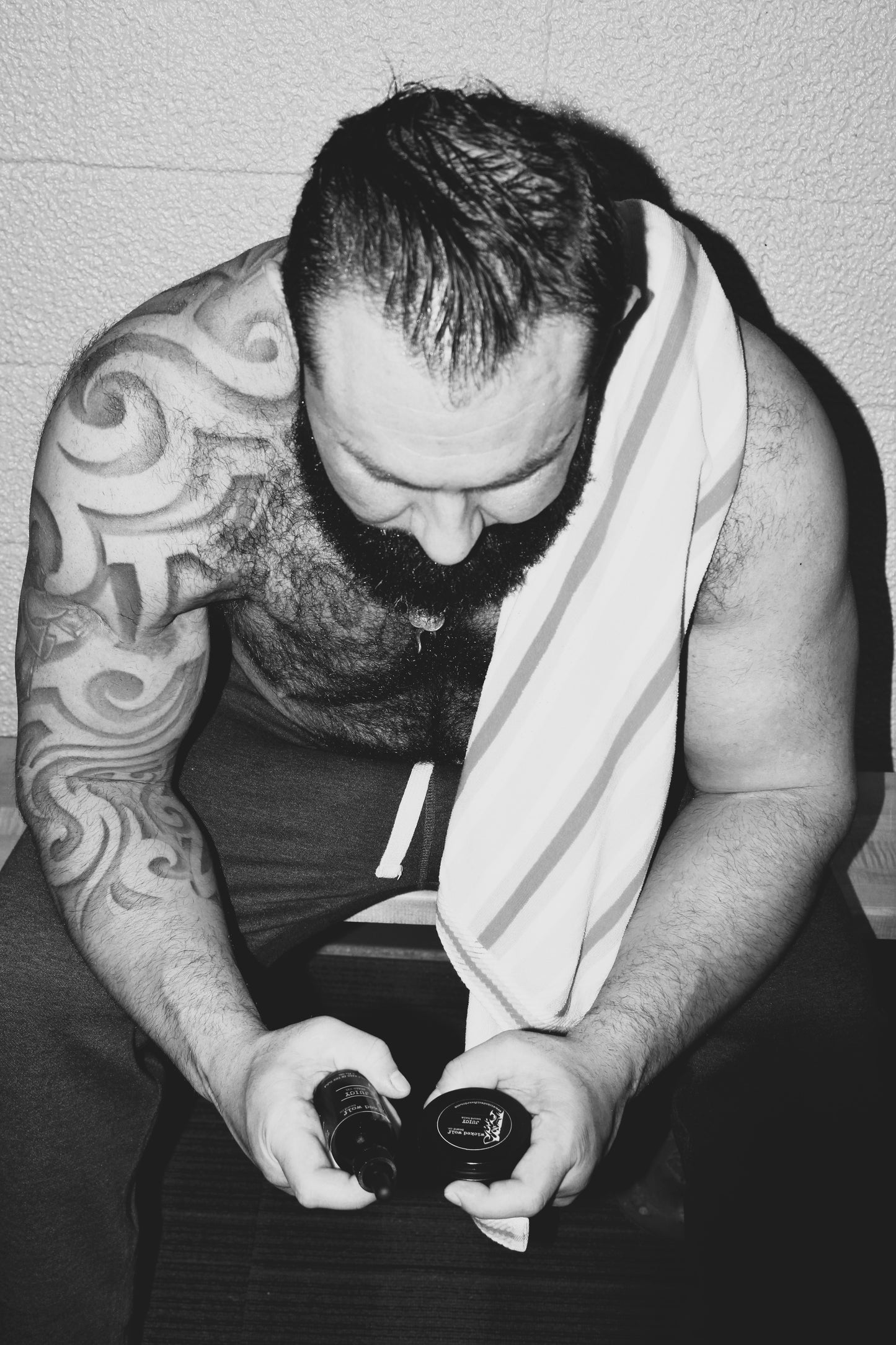 “Men’s beard grooming oil – Alpha tobacco vanilla oil styled in lifestyle setting”